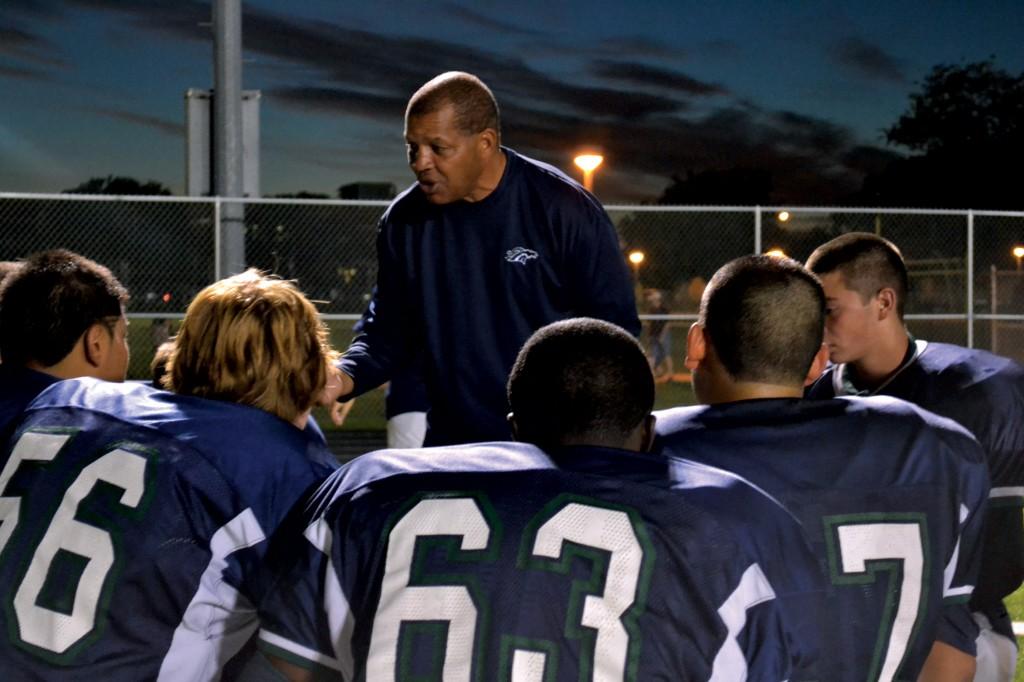 Coach Guillory gives a pep talk to the players during the game against Round Rock.