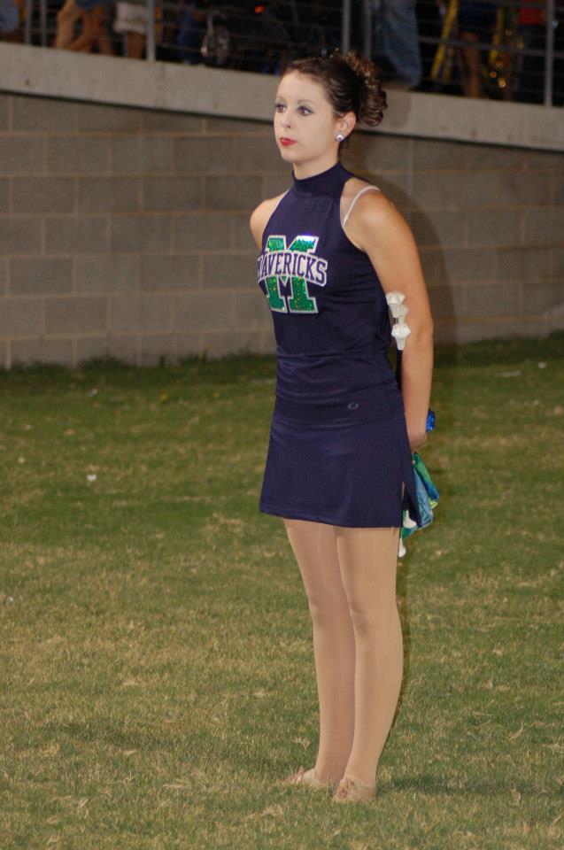 New twirler prepares to perform in halftime show.