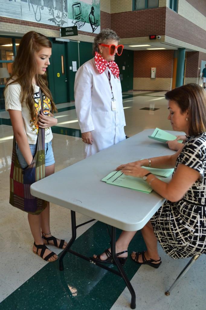 World history teacher, Karol Giblin, handed out schedules on the first day back from summer vacation.