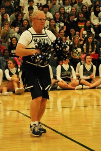 Lead Counselor Gary Vaden cheers for the Mavericks at the homecoming pep rally.