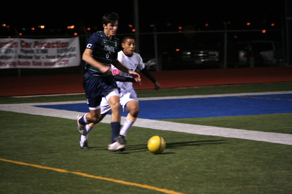 Team captain senior Sam Carlson steals the ball away from a Pflugerville defender.
