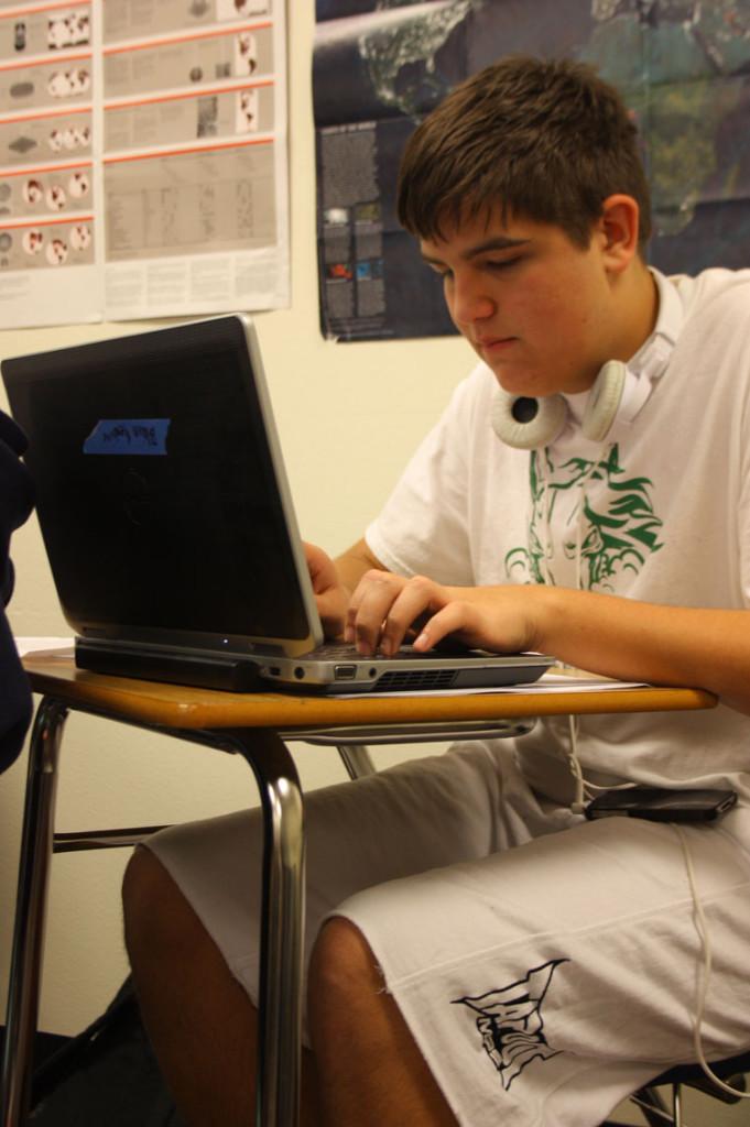 Freshman Blain Hendrix works on his school-issued laptop. The Class of 2013 was one of many future freshman classes to receive Dell laptops for school use. Students can access their work through google.docs, making collaboration much easier.