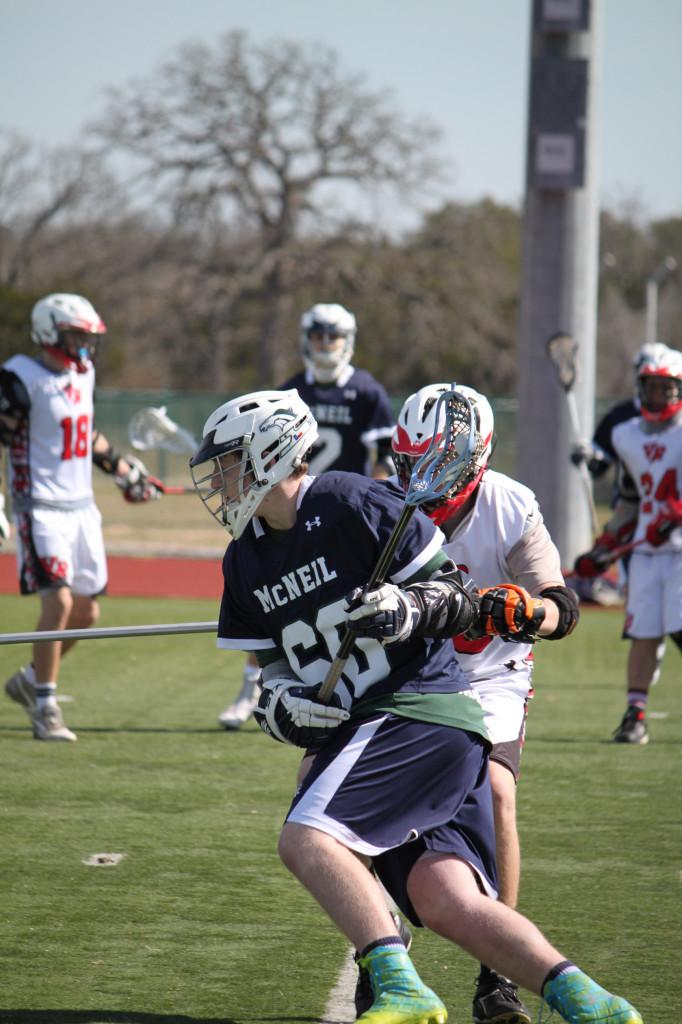 Boys Lacrosse player #60, Sophomore Colton Tillotson, contributes to the overwhelming victory over Vista Ridge. 