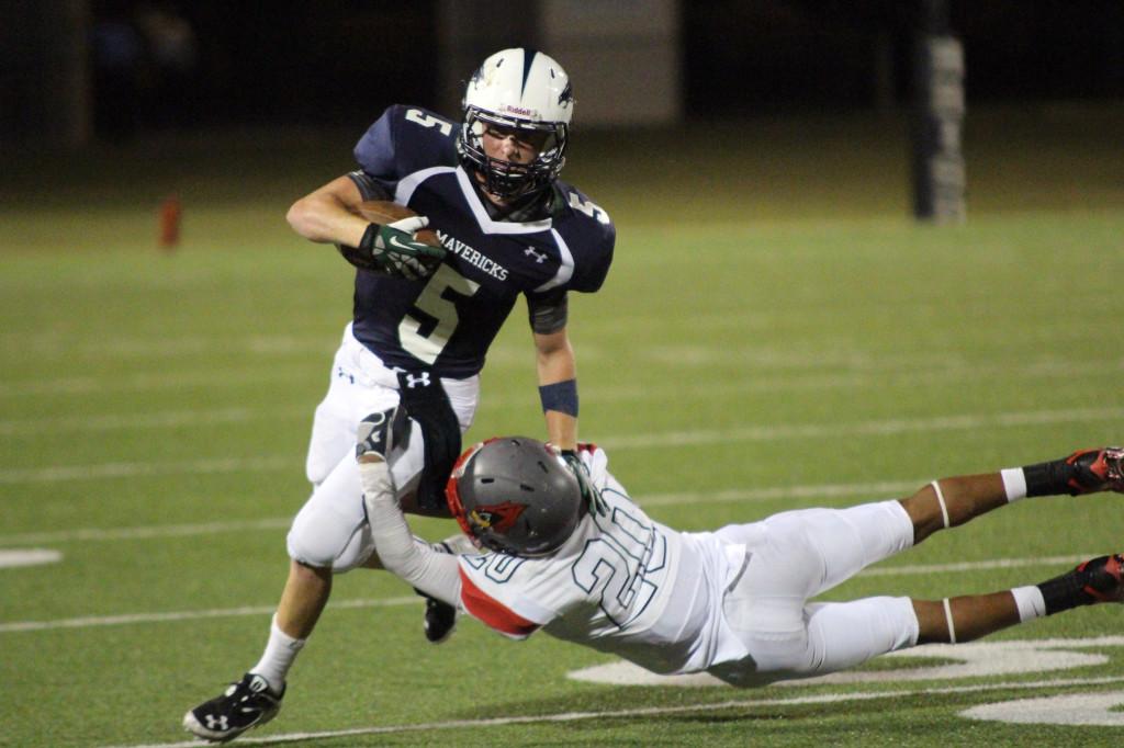Colton Russell stiff arms a Del Valle defender.