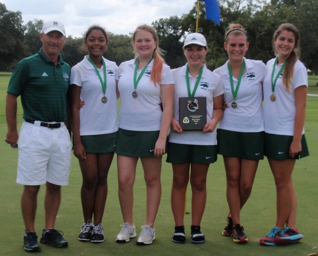 Golf Coach Matt Hoover, freshman Maia Espino, freshman Avery Willenborg, freshman Ashley Neves, junior Payton Bednarski, and junior Mandy Chittick celebrate their win at the Northside Invitational Golf Tournament on Oct. 29