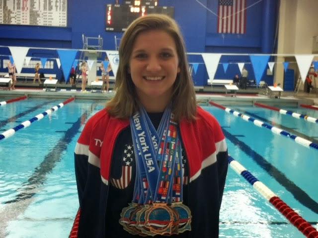 Sophomore Alix Gavin poses with her new hardware at the Deaf International Swimming Championship