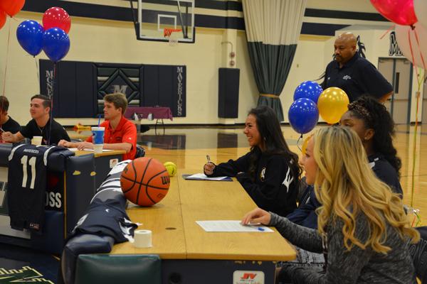 The athletes prepare to sign their Letters of Intent.