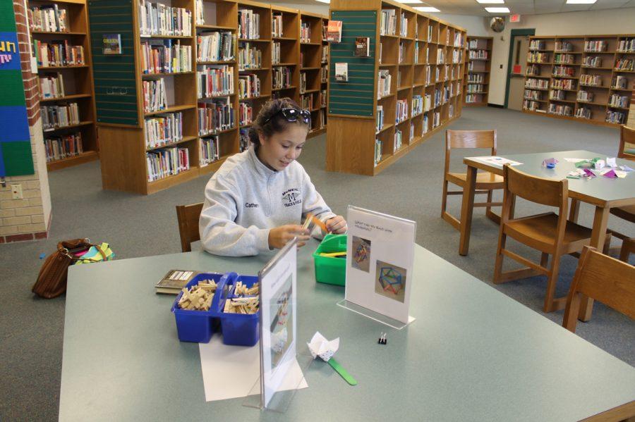 In the library, senior Catherine Podmore builds and creates at the tower Makerspace.