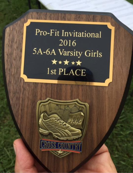 The Varsity girls cross country team was awarded a plaque. They  placed first overall in the Temple Pro-Fit Invitational on Friday, Sept. 2.