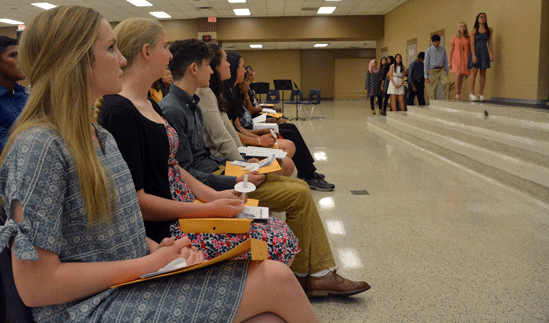Students wait for their names to be called at the ceremony. Claire Bean, pictured in the foreground is just one of the many juniors and seniors who attended the ceremony to celebrate getting accepted to National Honors Society.