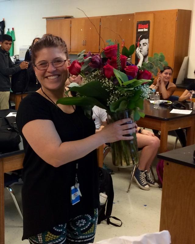 Teacher of the Year Alison Bouwman (right) and Paraprofessional of the Year Ruby Lozano (left) celebrate their wins with a bouquet of flowers delivered by the administration.