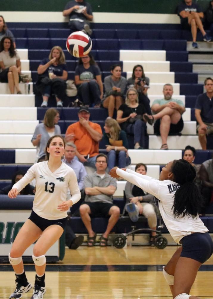 Aliyah Levert digs up ball that Emma Ramirez sets up