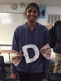 Junior Amrita Mayavaram poses with her letter, D. Her sin involves disobedience.