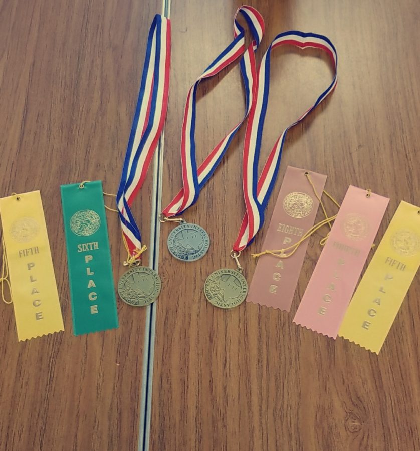 Students place in Journalism UIL Central Texas practice meet and receive medals and ribbons.