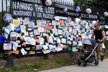 A memorial wall outside Green-Wood Cemetery in Brooklyn, New York pays tribute to Covid-19 victims on Thursday, May 28