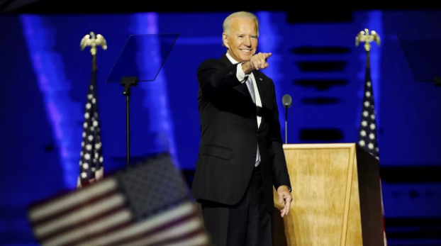 President-elect Biden stands onstage at victory speech in Wilmington, Del.