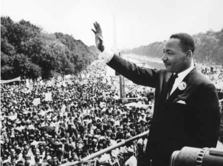 Martin Luther King Jr. waving to the crowd as he delivers his “I Have a Dream” speech in Washington, D.C.