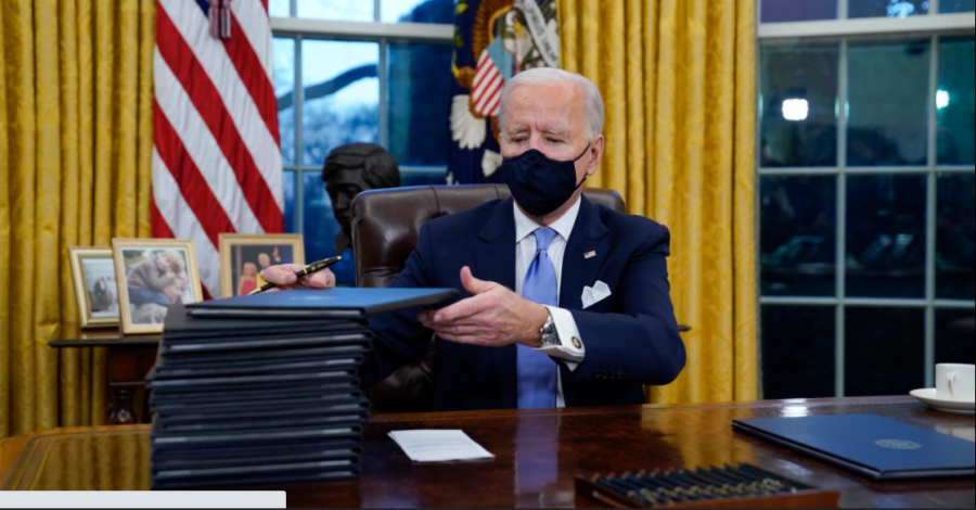 President+Biden+signs+17+executive+orders+during+his+first+day+in+office.+