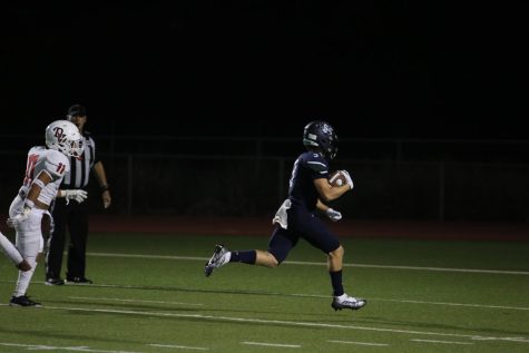 In the last moments of the game, senior wide receiver Adam Needing runs the ball in for the last touchdown of the game. The Mavericks beat Del Valle in the first game of the season with a score of 49-13.