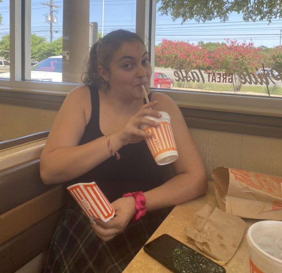 At+Whataburger%2C+Gabby+Cohen+takes+a+drink+from+her+chocolate+milkshake.+The+shake+was+pretty+good%2C+Cohen+said.+I+always+enjoy+the+sweetness+of+a+milkshake+with+the+saltiness+of+some+fries.