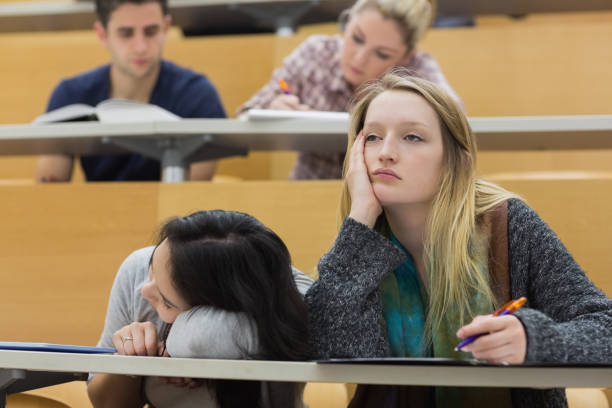 Demotivated Students in a Lecture Hall Stock Photo.