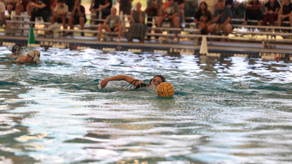 In their Sept. 17 game against Westwood, junior captain Gabrielle Allen swims on a fast break.