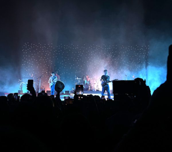 The band ends 'Uncomfortable' before lead singer Dylan Minnette jumps into the crowd.