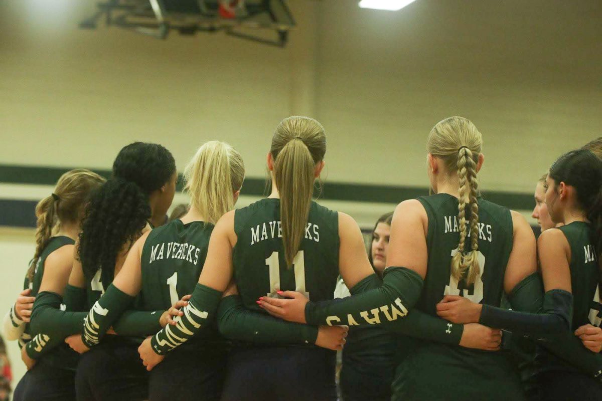 From their Sept. 10 game against Vista Ridge, varsity volleyball meets in a huddle in between games.