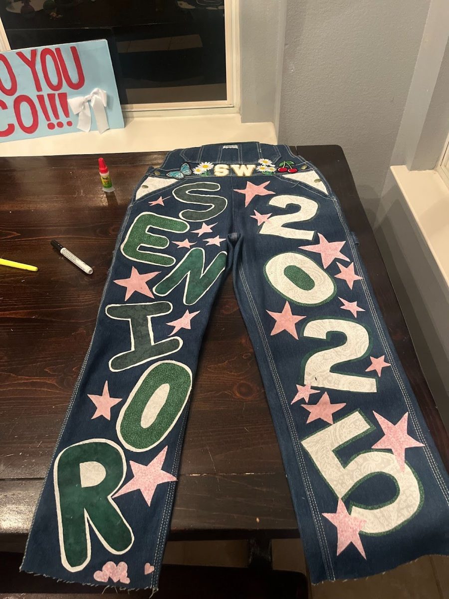 
A pair of decorated overalls designed by senior Shaylee Wood for last Friday’s homecoming football game. “I’m really proud of my work,” Wood said. “I got all my supplies from Hobby Lobby.”