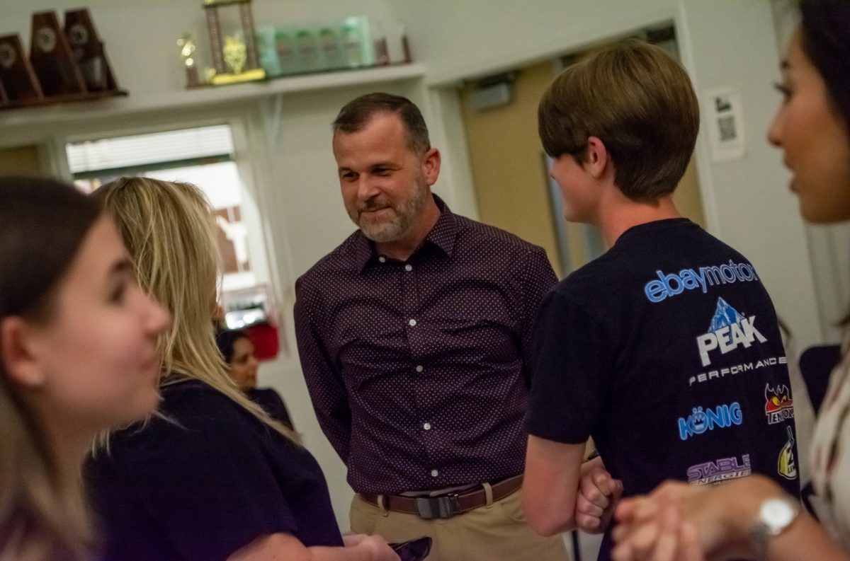 Jason Dimiceli enjoys his retirement party on Sunday April, 27 thrown by
the Mav Band Boosters. This retirement party was open to the public where
Dimiceli enjoyed talking to many friends, family, students and Alumni.