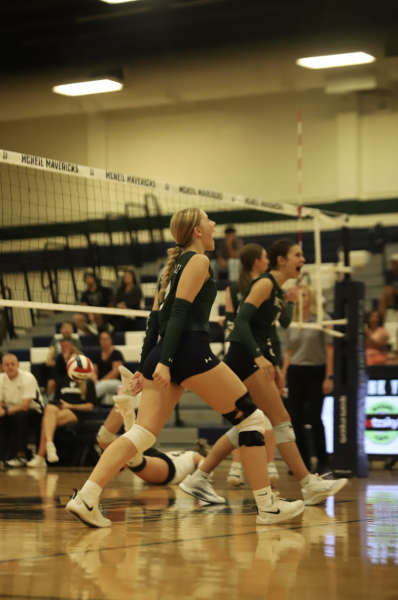 The Lady Mavs celebrate the point after a hard fought rally.