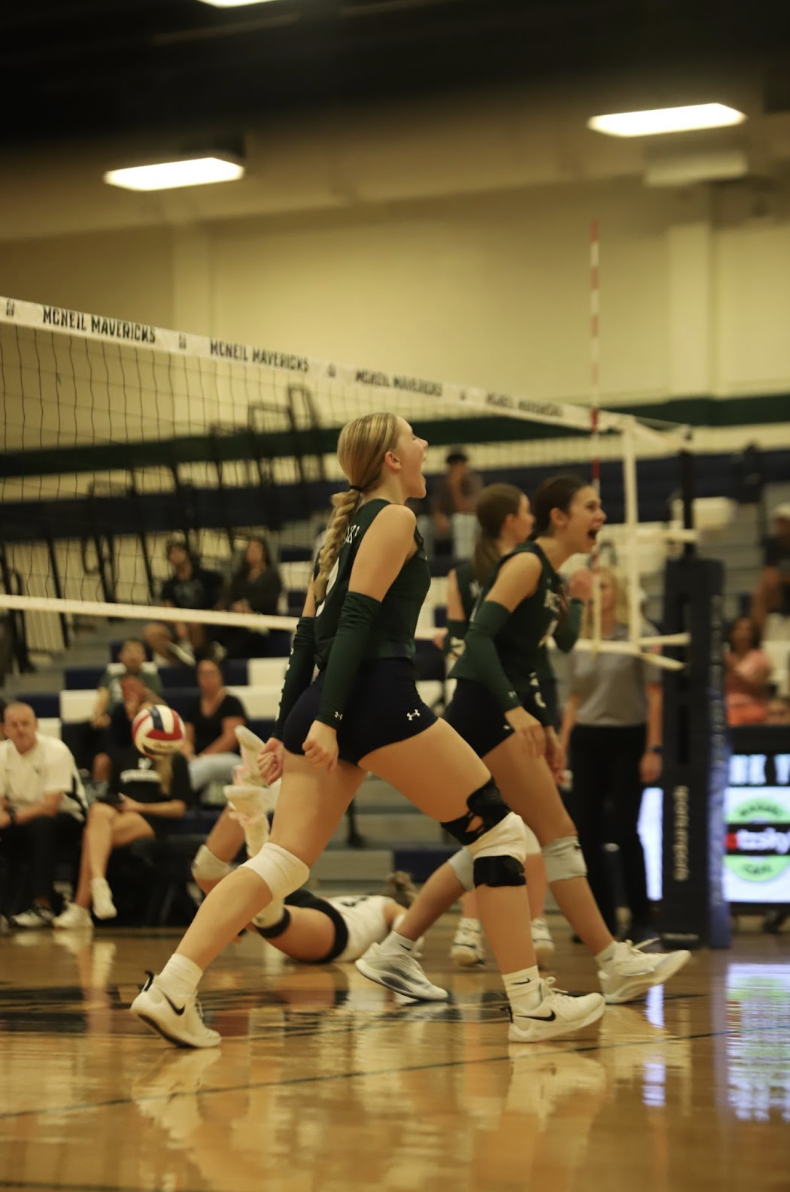 The Lady Mavs celebrate the point after a hard fought rally.