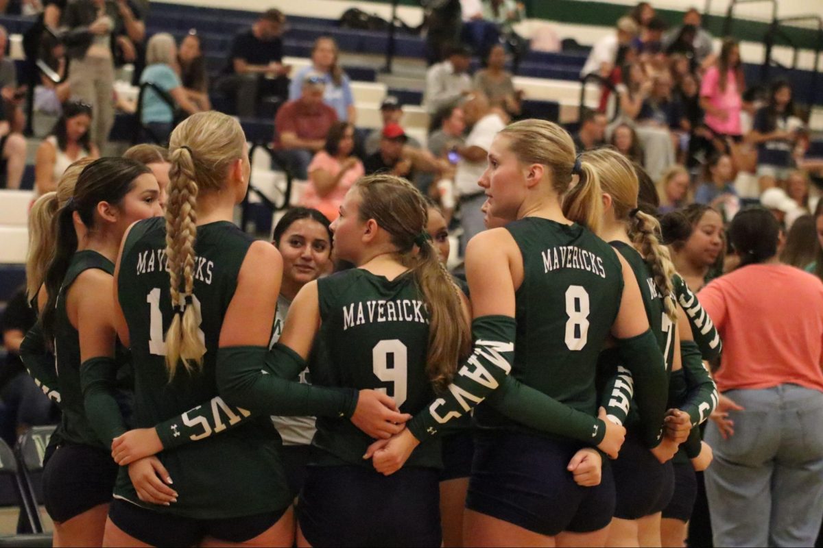 Varsity Volleyball huddle in preparation for the second set in their match against Round Rock 
