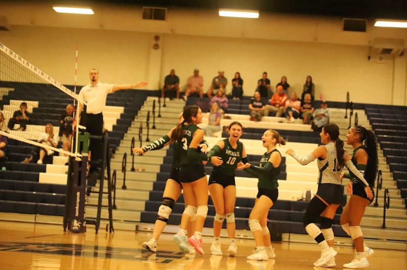Mavericks celebrate after successfully winning a point