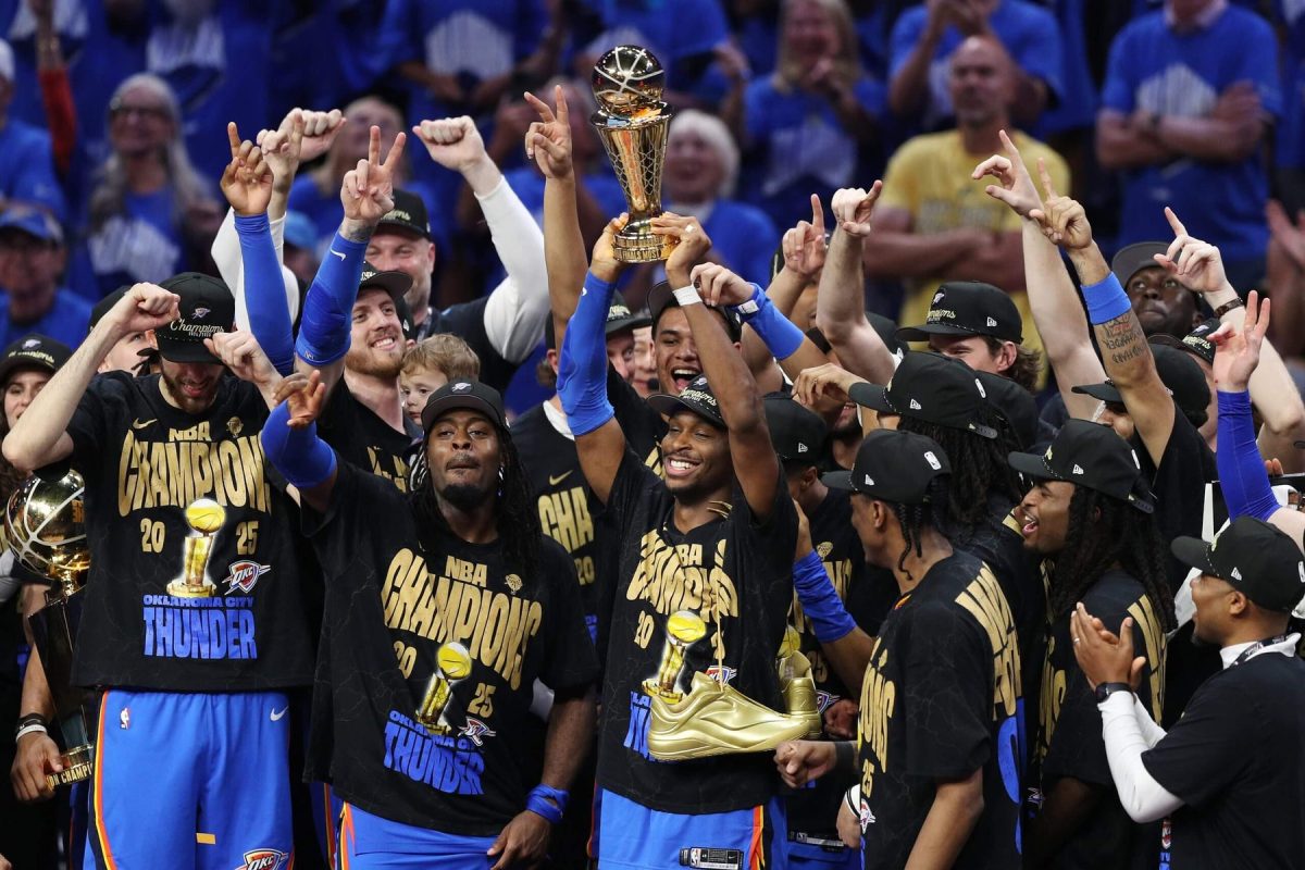 Thunder point guard Shai Gilgeous-Alexander holding up the Finals MVP trophy after the Thunder's win. Photo Courtesy of the New York Times