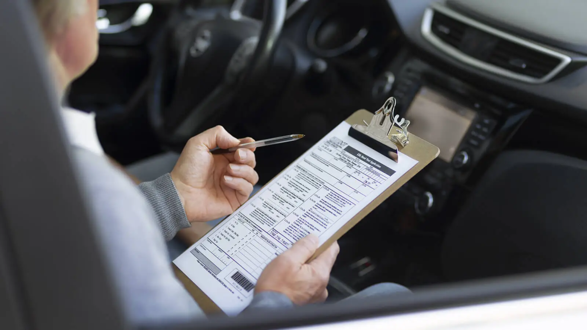Image detailing the process of being graded by an instructor during a driving test. Photo Courtesy of Zip Moving and Storage