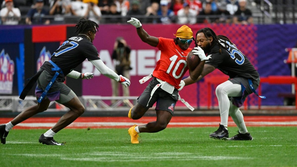 Miami Dolphins Wide Receiver Tyreek Hill jukes defenders in the inaugural NFL flag-football game in 2023. Photo Courtesy of WPTV