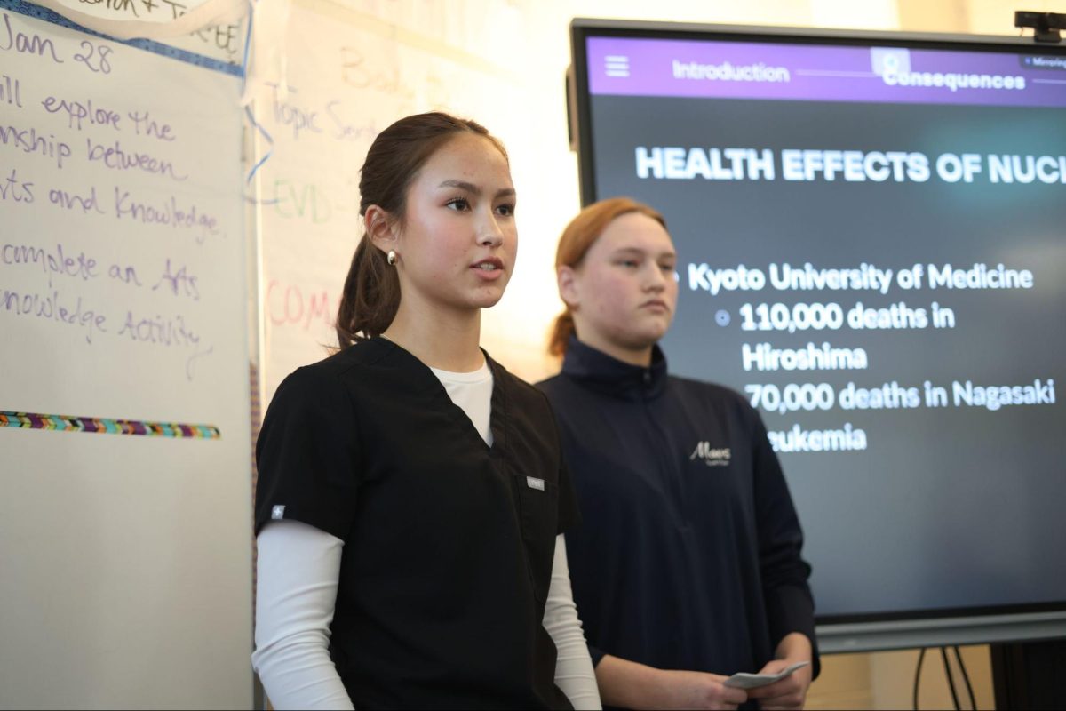 Juniors Ariya Thompson and Kristen Burke presenting for AP Seminar. “It is a great class to express your opinion and practice public speaking skills,” Thompson said. “The experience taught me how to not procrastinate and how to block out my hours to identify what needed to be done.” 