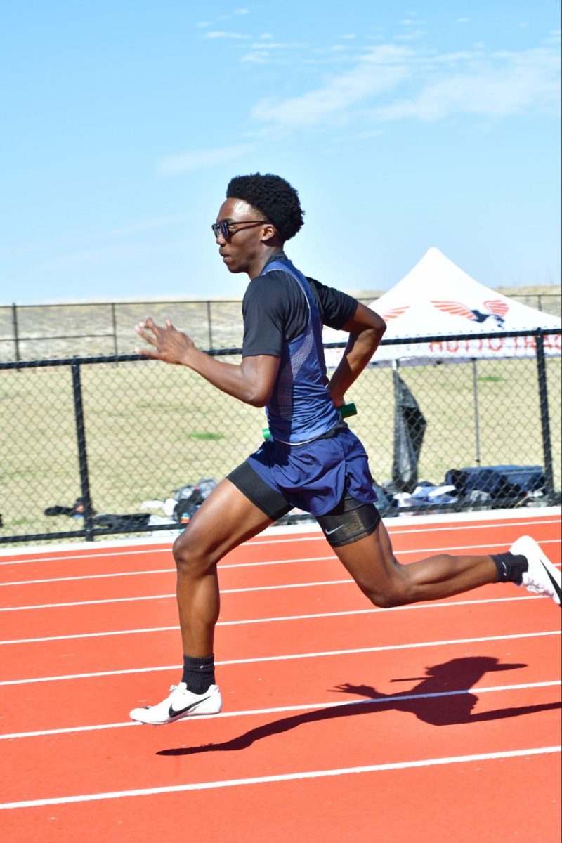 AJ Gates (10) rounding the curve in the 4x200 meter dash at McNeil's first meet on Feb. 18.