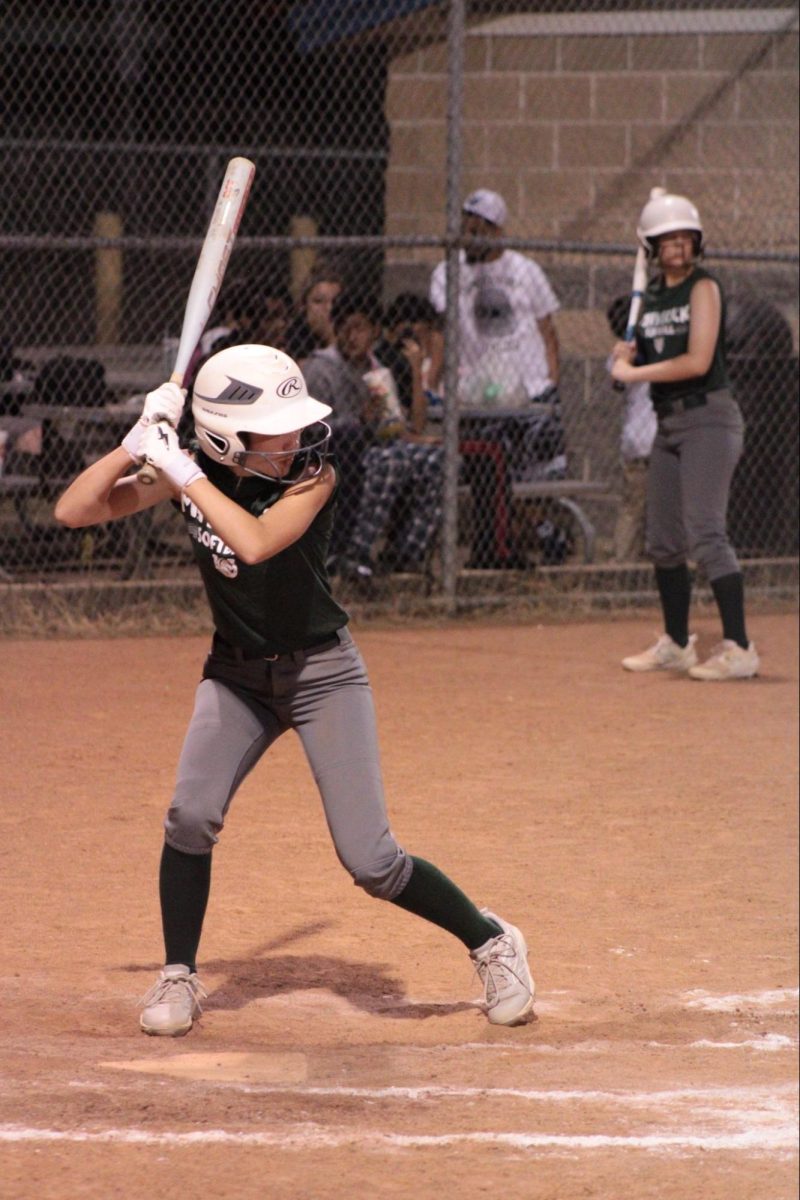 Sophomore London Peterson loads, anticipating the upcoming pitch in a Mavericks preseason fall ball matchup on Monday, Sep. 29.
