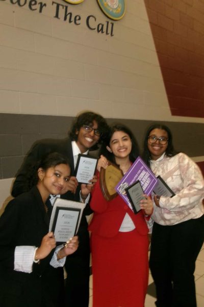 From left to right, Lasya Kandagatla (10), Nikhil Sridharan (11), Aditri Chakraborty (11), and Madison Johnson (12) hold their plaques after qualifying for NSDA Nationals, with Chakraborty also holding the team’s Speech Sweepstakes plaque. Photo Courtesy of Camila DaRosa (11),