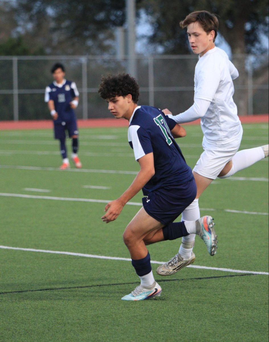Aymane El Anssari going in to steal the ball in their matchup against Vandegrift on Tuesday Feb. 24. Image by Viera Gonzales
