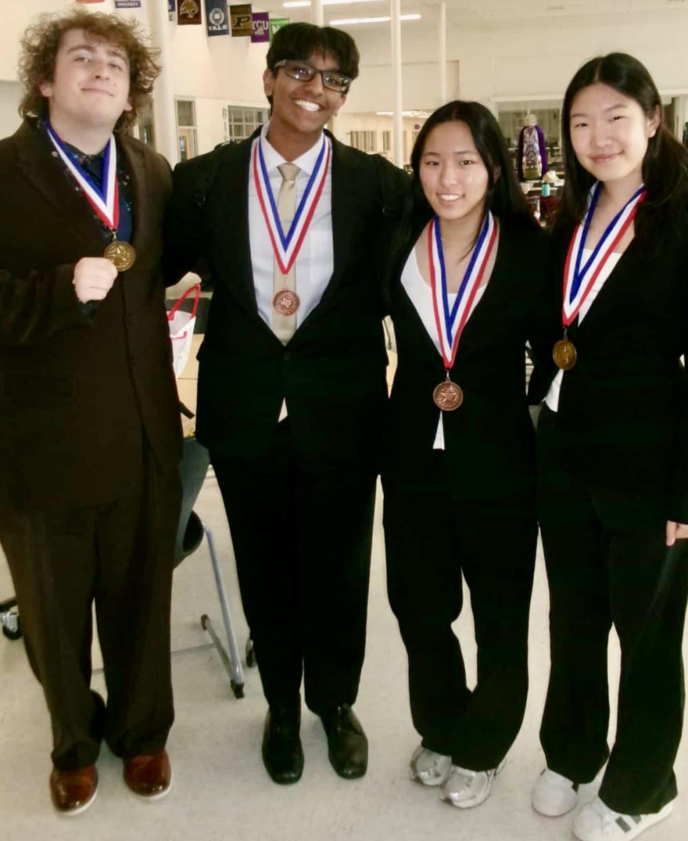 From left to right: Grady Smith (10), Nikhil Sridharan (11), Karen Kim (10), and Haebin Kim (10) pose after advancing to regionals in their respective events. Photo courtesy of Nikhil Sridharan (11)
