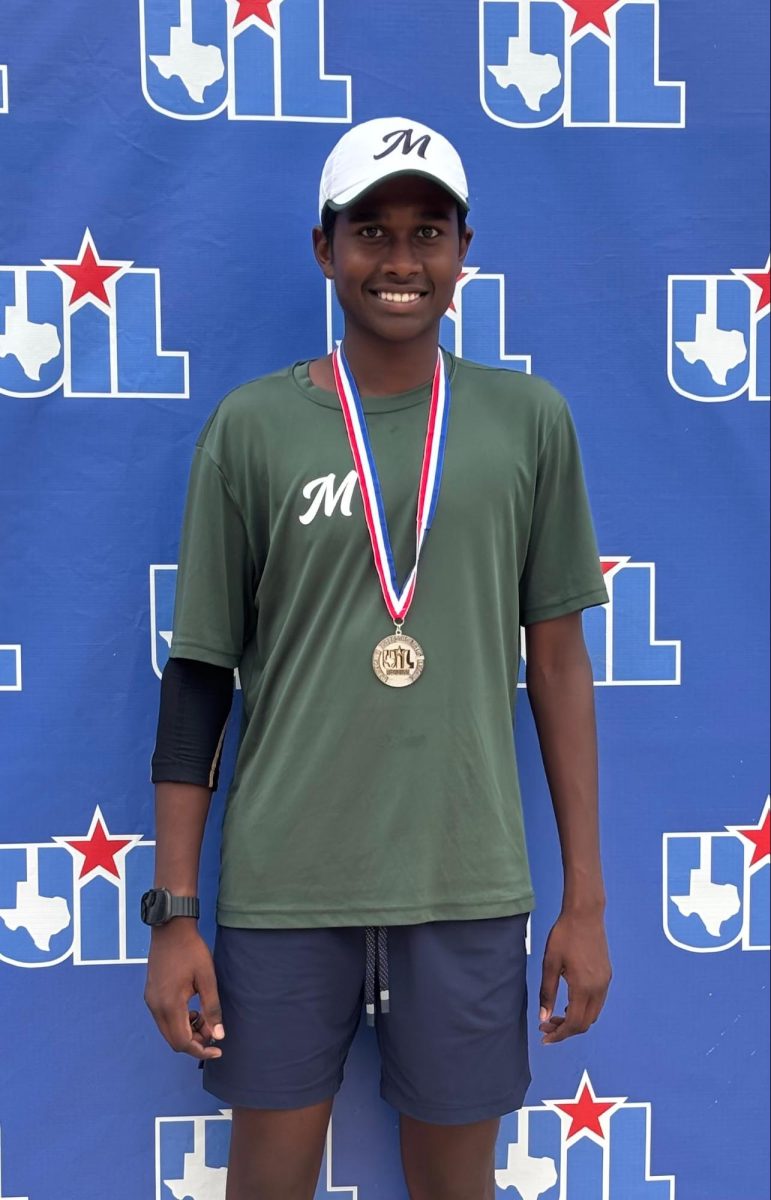 Sophomore Jaivanth Sathish claiming his medal from regional match. 
